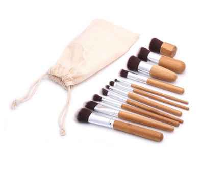 11 bamboo handles, makeup brush, tool set, linen bag, blush brush, foundation brush, and a full set of makeup.